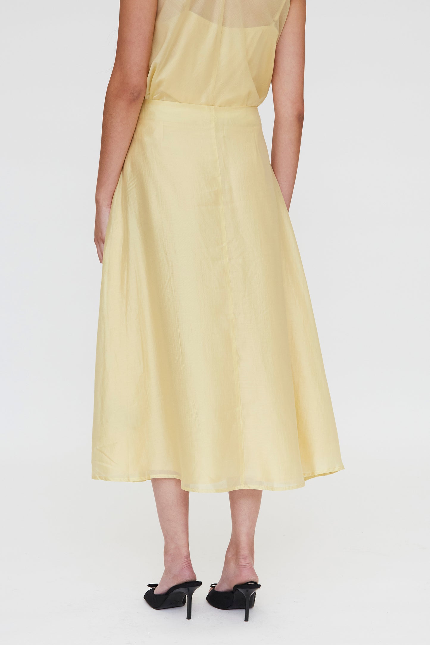 FALDA MIDI FLUIDA AMARILLA